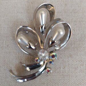 Vintage silver tone flower brooch with AB stones and faux pearls.
